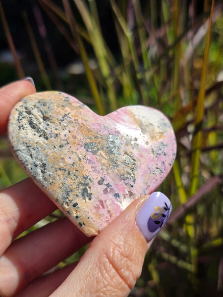 Rhodonite with pyrite heart